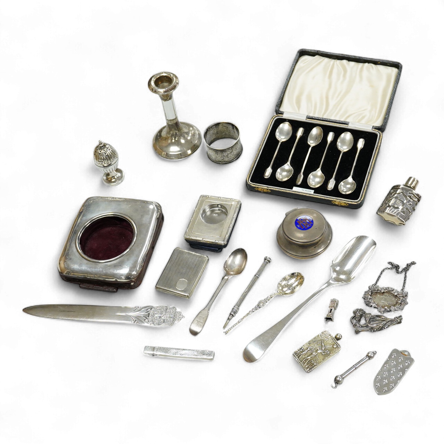 A collection of assorted small silver, including set of six 1930's coffee spoons, a mounted travelling pocket watch case, Victorian pepperette, mounted glass dwarf candlestick, enamelled powder box, Georgian stilton scoo
